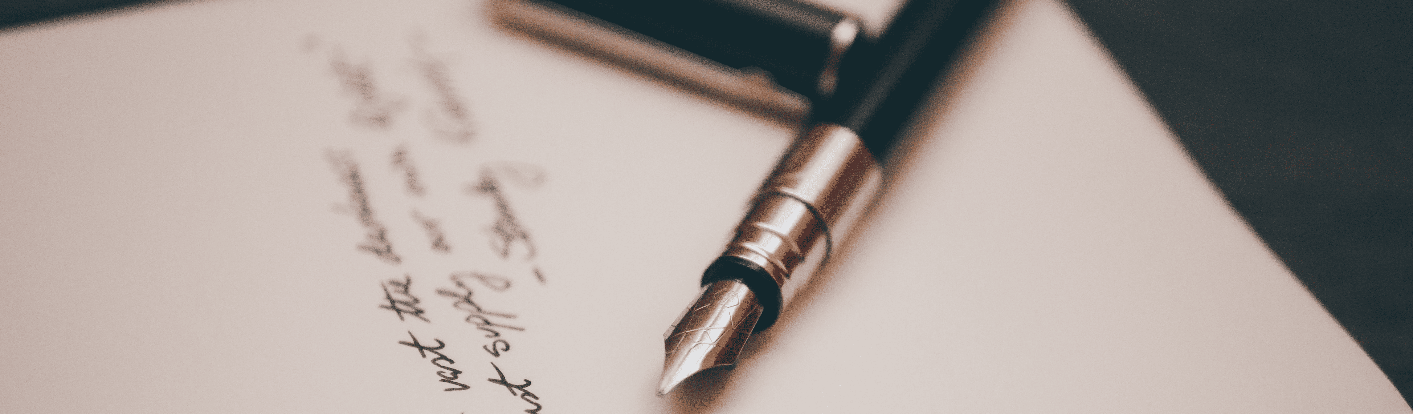 Fountain pen resting on handwritten business notes