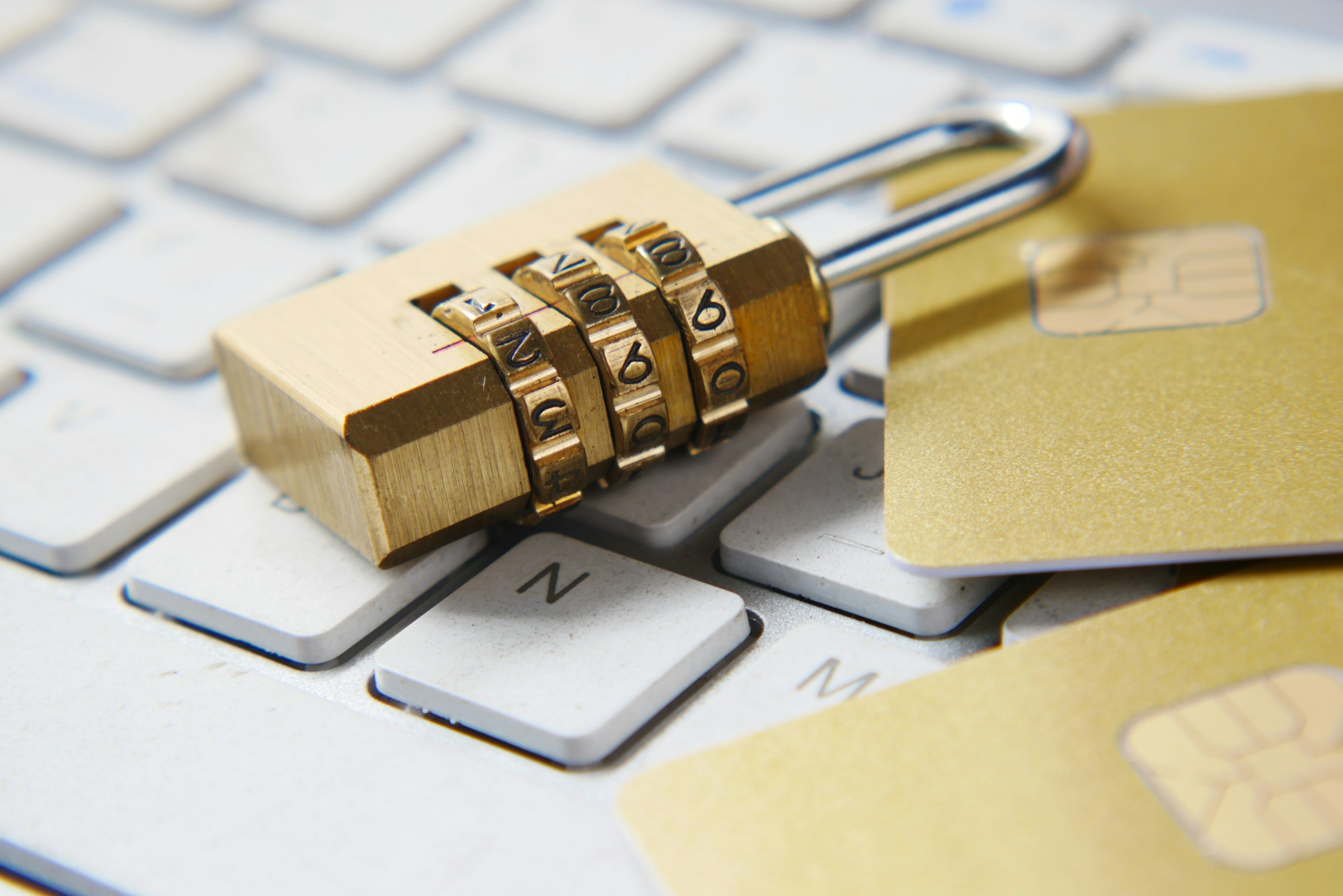 Combination padlock resting on a computer keyboard