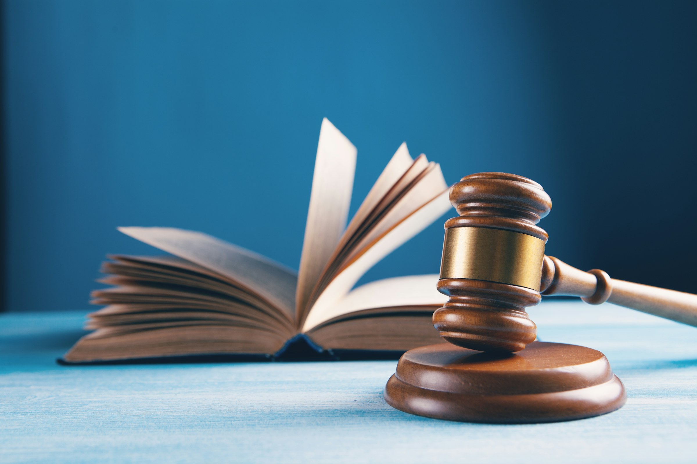 Judge’s gavel beside an open law book