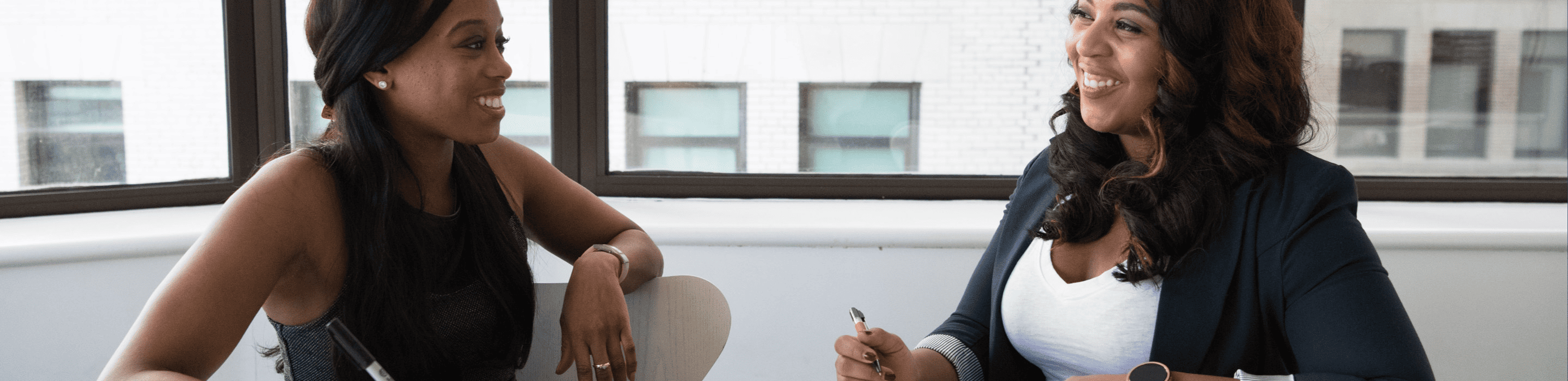 Professionals in conversation during a meeting